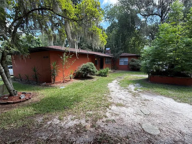 a backyard of a house with lots of green space