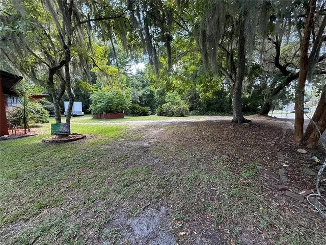 a view of outdoor space with deck and tree