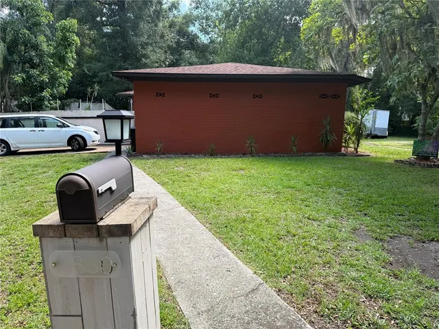 a house view with a backyard space