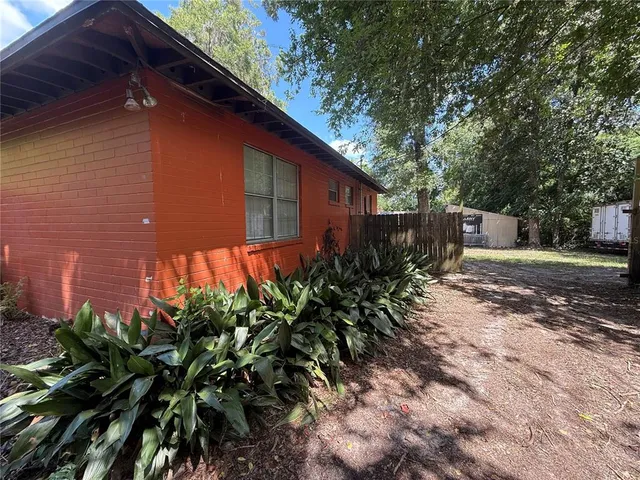 a backyard of a house with lots of green space