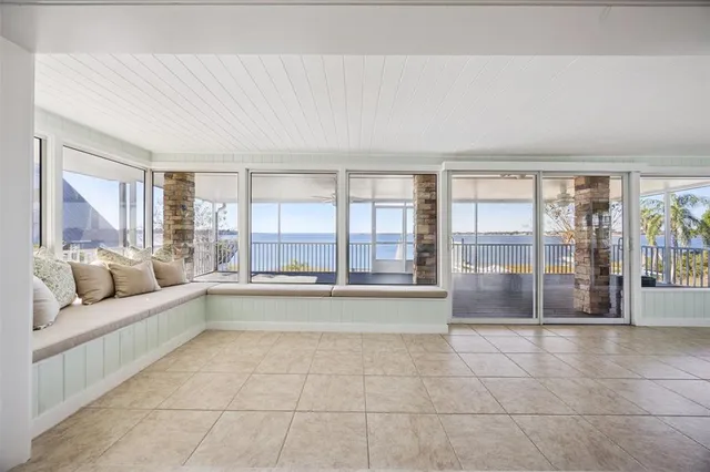 a living room with a bed and furniture