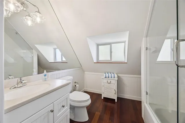 a view of a fountain in front of a house with a big yard