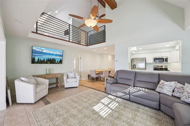 a kitchen with granite countertop a stove microwave and refrigerator