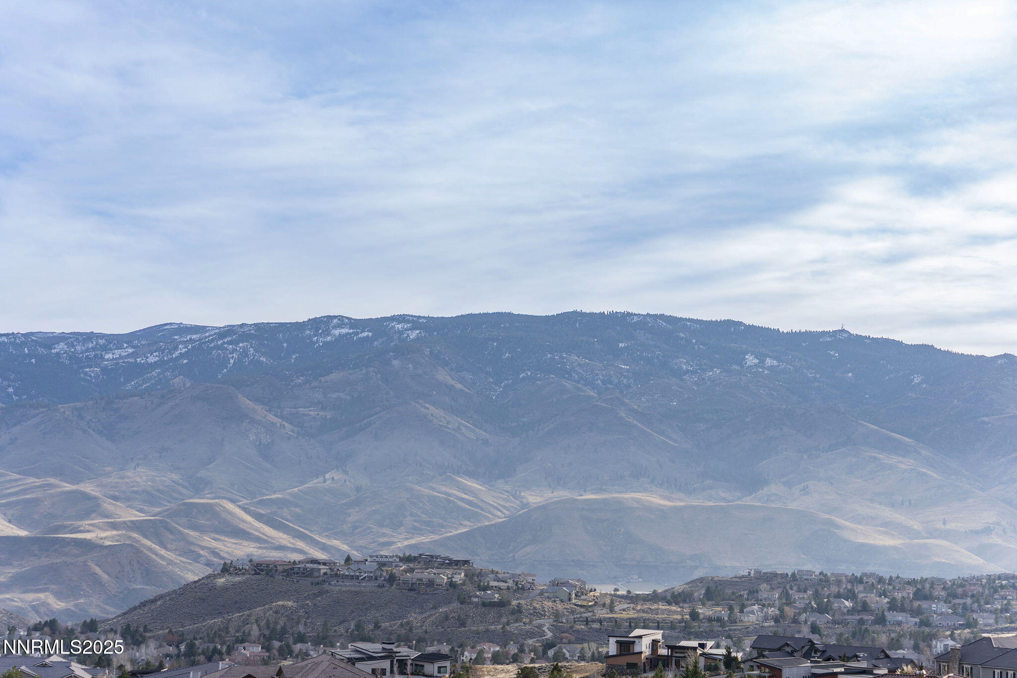 8195 Fox Meadows Court Reno, NV 89523 - Photo 15 of 15 a view of a large mountain with mountains in the background
