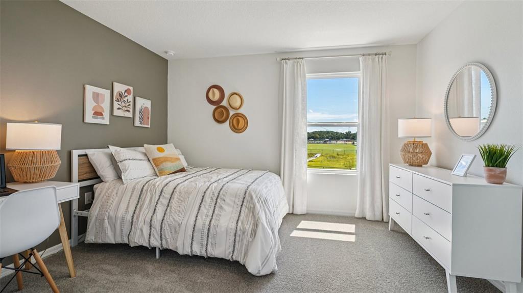 3066 Northeast 21st Ct Road Ocala, FL 34479 - Photo 22 of 27 a bedroom with a bed and a window