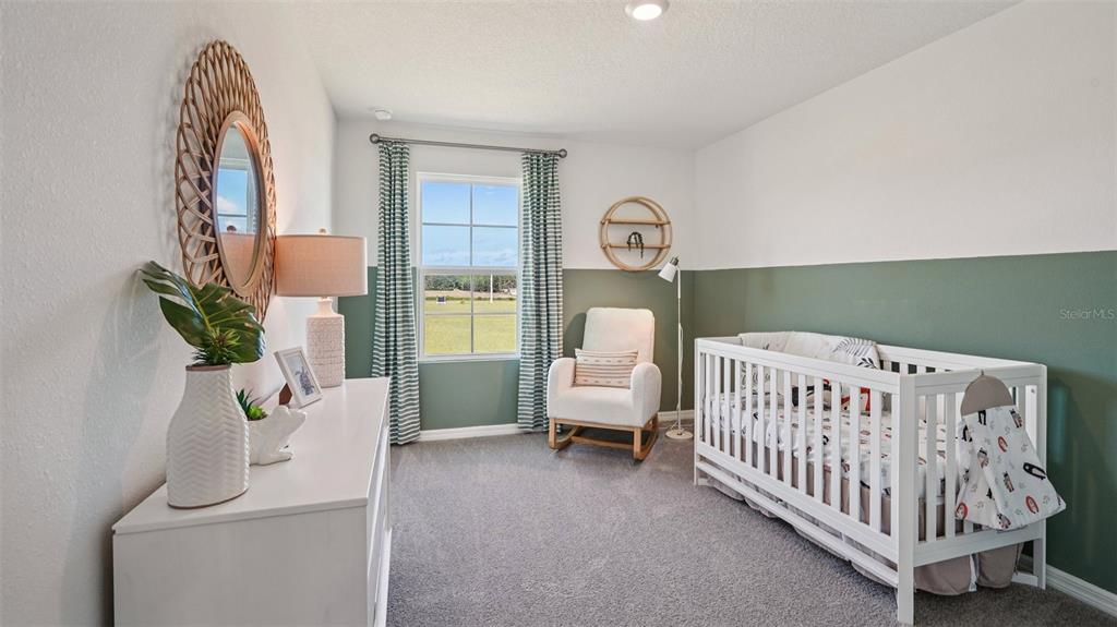 3066 Northeast 21st Ct Road Ocala, FL 34479 - Photo 23 of 27 a bedroom with a bed and a window