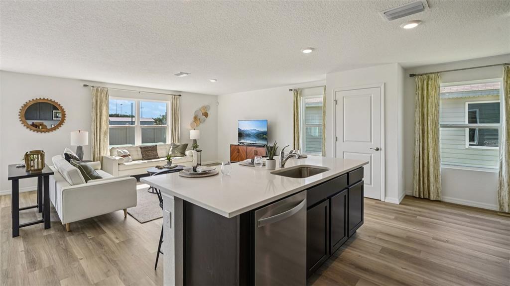 3066 Northeast 21st Ct Road Ocala, FL 34479 - Photo 6 of 27 a view of a kitchen counter space and wooden floor