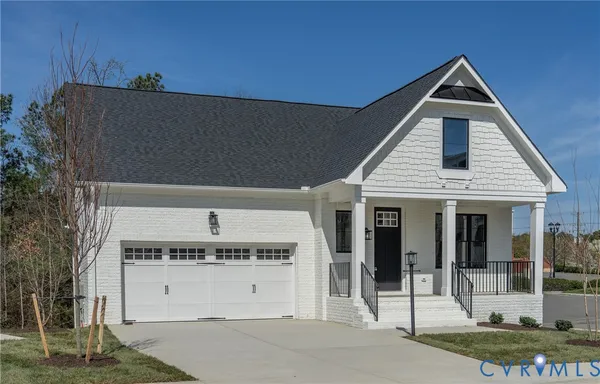 a front view of a house with a garage