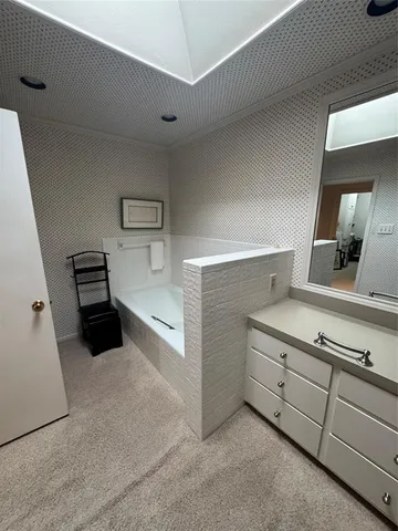 a bedroom with a bed and a cabinets