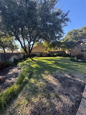 a view of a backyard with green space