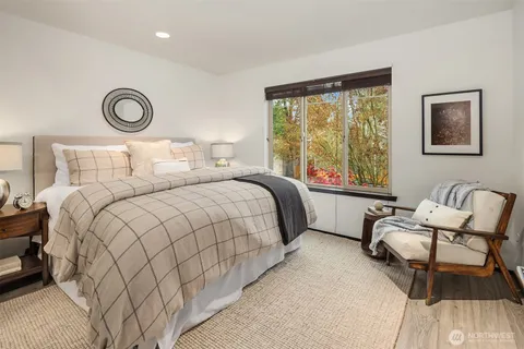 a bedroom with a bed and a couch