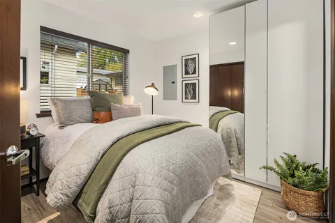 a bedroom with bed and window