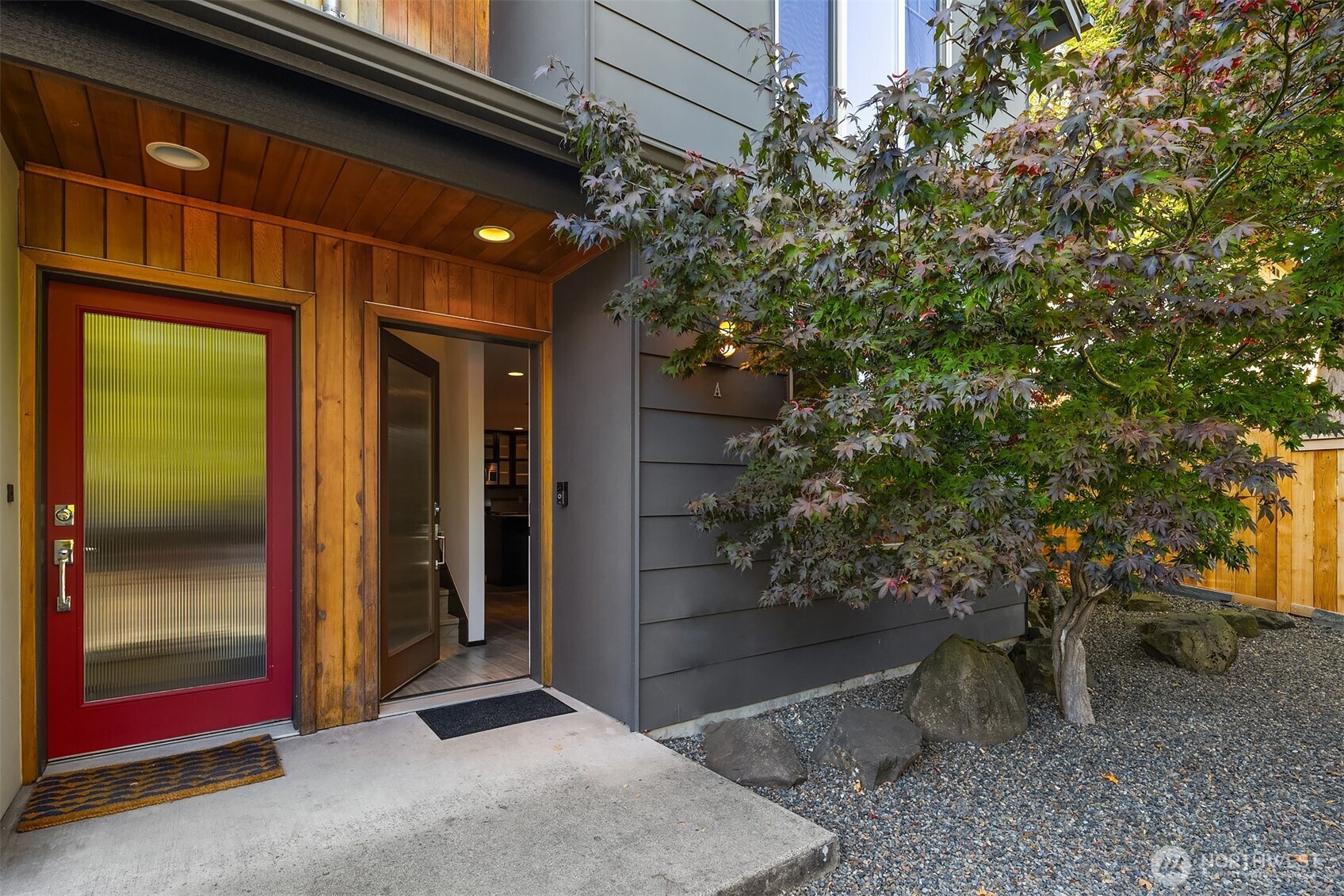 5935 Fauntleroy Way Southwest, Unit A Seattle, WA 98136 - Photo 18 of 20 a view of a entryway door of the house