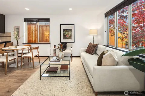 a living room with furniture and a window