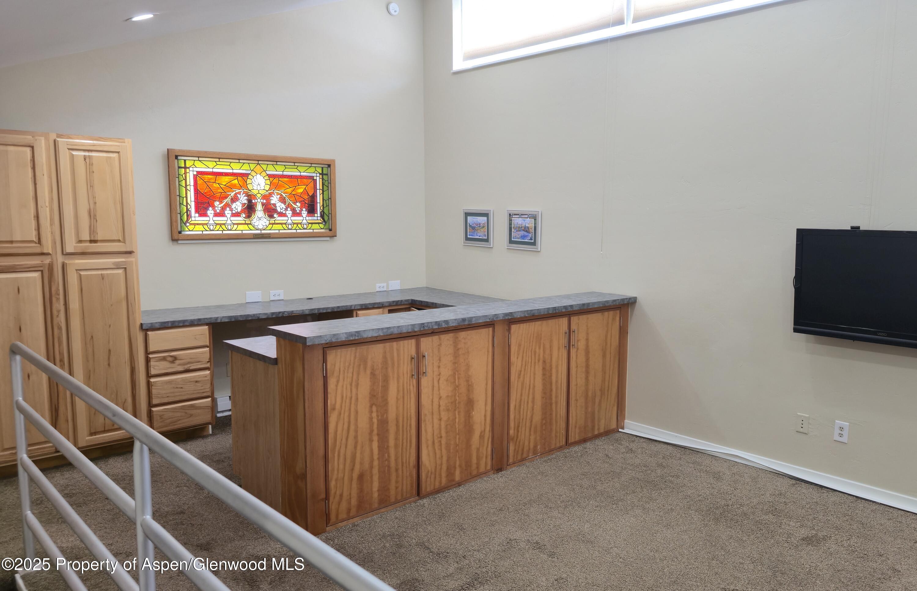 175 Midland Avenue, Unit 4 Basalt, CO 81621 - Photo 13 of 17 Upstairs room with TV