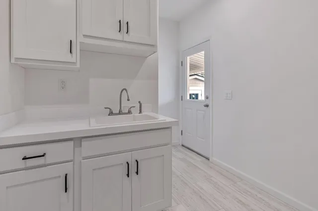 a bathroom with a sink and mirror