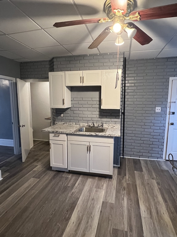 181 Division Street Fall River, MA 02721 - Photo 12 of 14 a kitchen with granite countertop a stove cabinets and wooden floor
