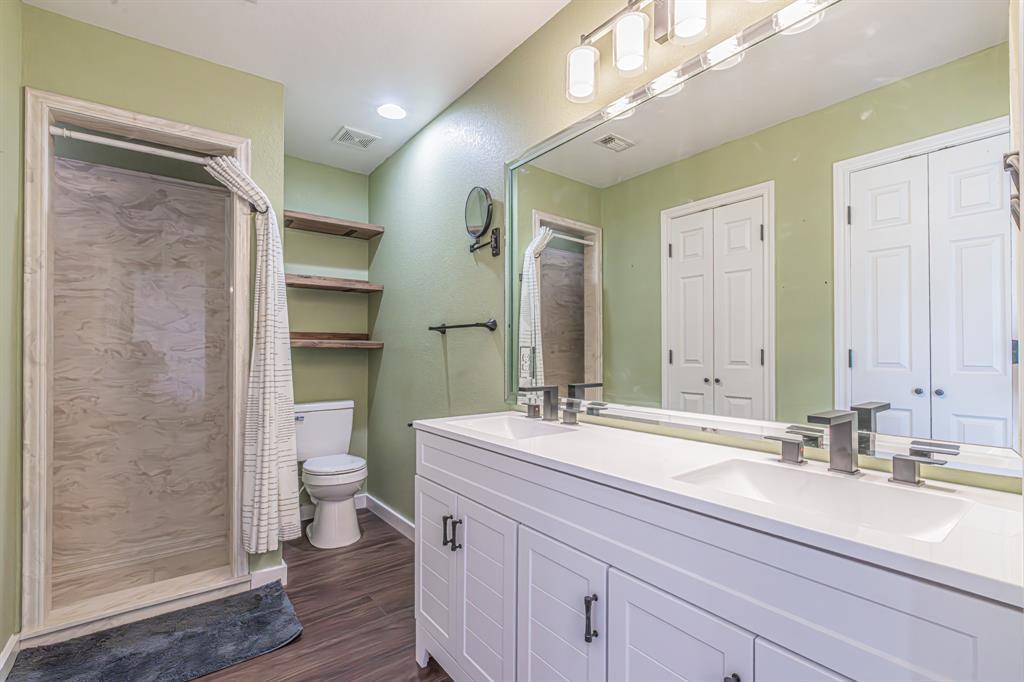 204 Spring Branch Trail South Springtown, TX 76082 - Photo 30 of 39 Bathroom featuring a dual vanity with white cabinetry, integrated sinks, and brushed nickel fixtures