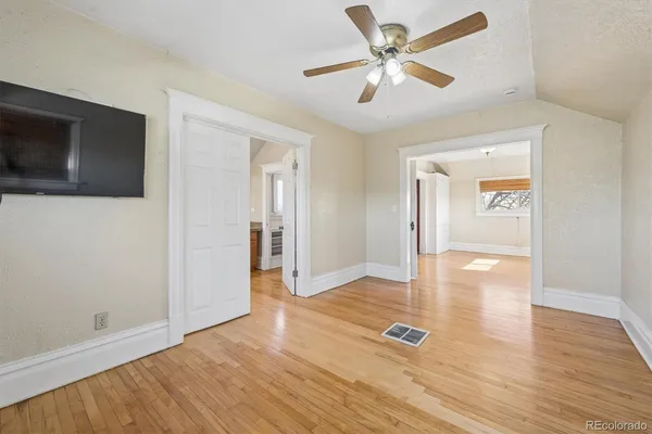 a view of a livingroom with wooden floor