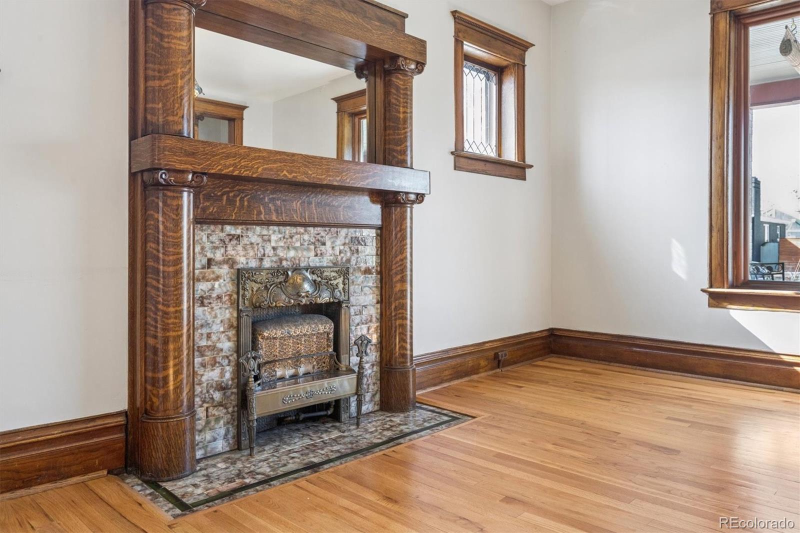 3828 Tejon Street Denver, CO 80211 - Photo 31 of 36 a living room with a fireplace
