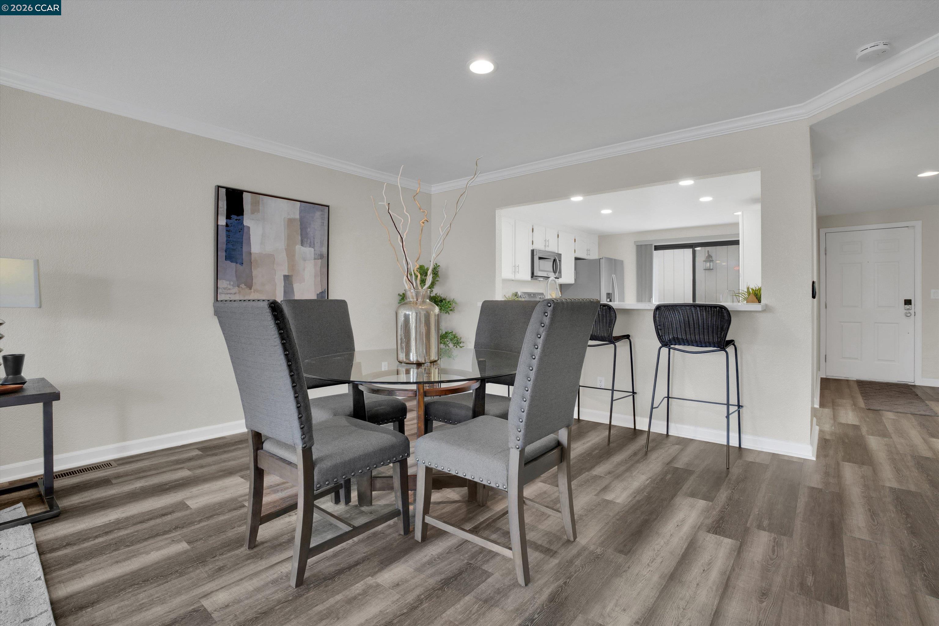 1605 Riverlake Road Discovery Bay, CA 94505 - Photo 14 of 39 a view of a dining room with furniture and wooden floor