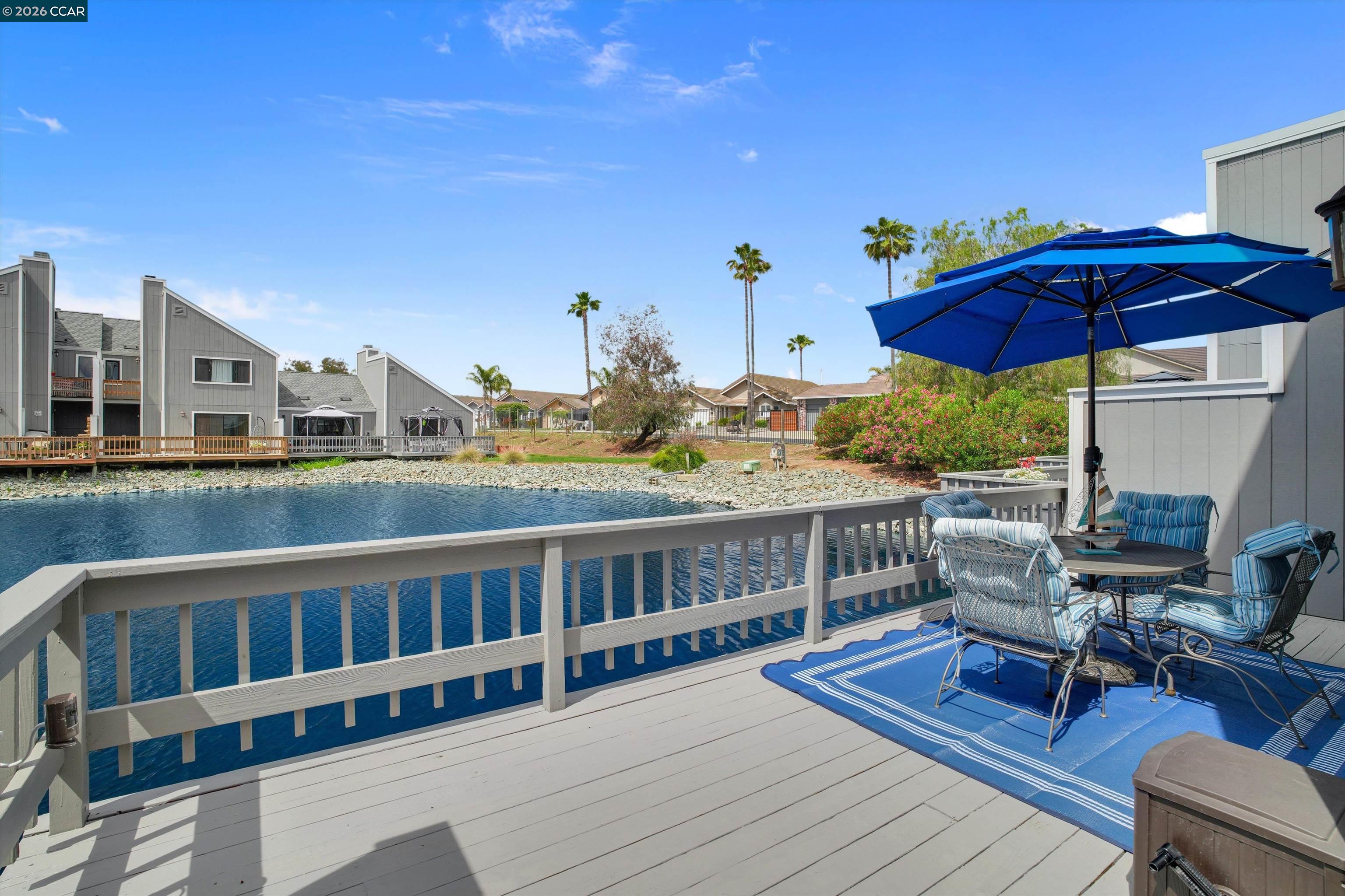 1605 Riverlake Road Discovery Bay, CA 94505 - Photo 20 of 39 a view of a house with wooden deck and furniture