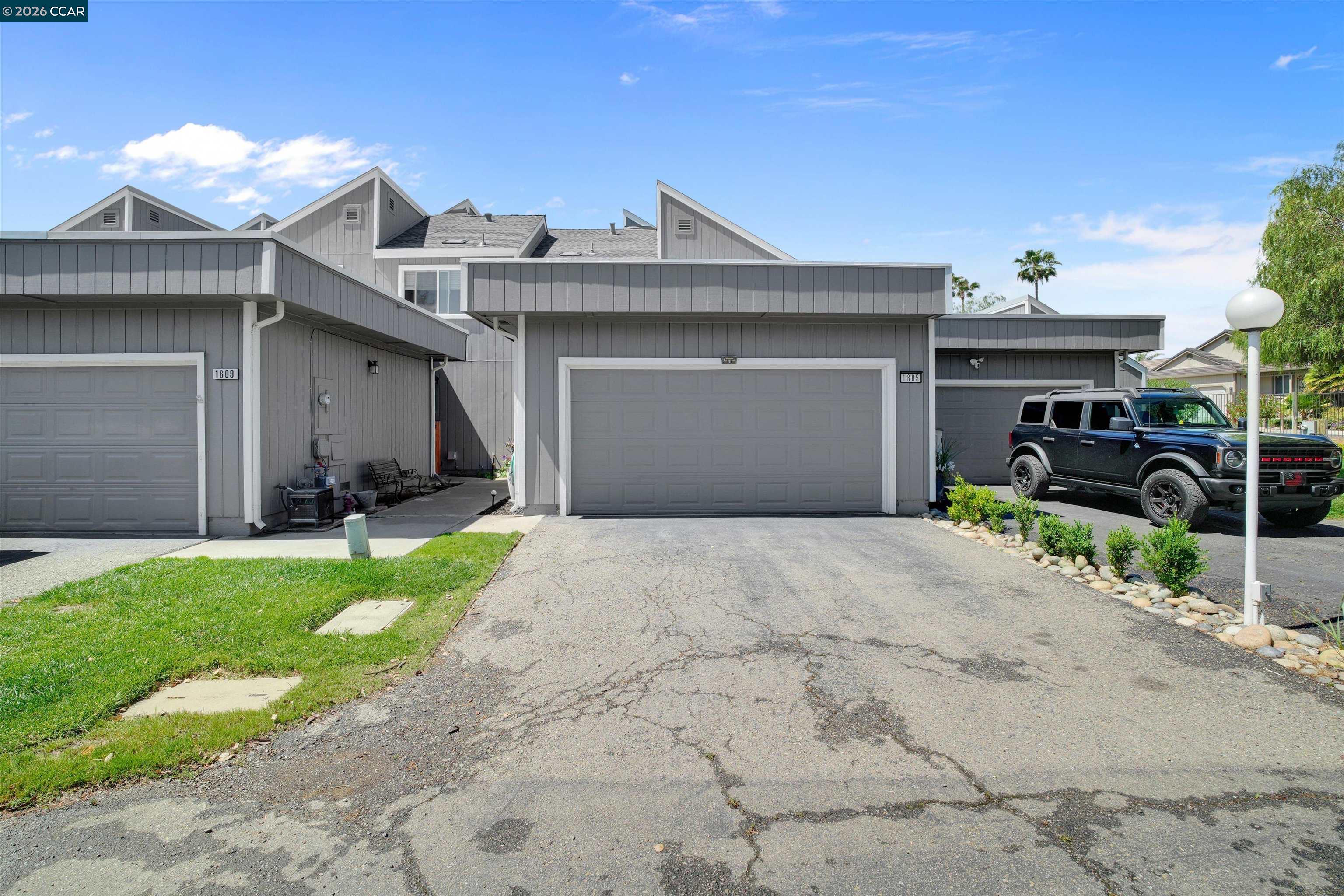 1605 Riverlake Road Discovery Bay, CA 94505 - Photo 2 of 39 a front view of a house with garden