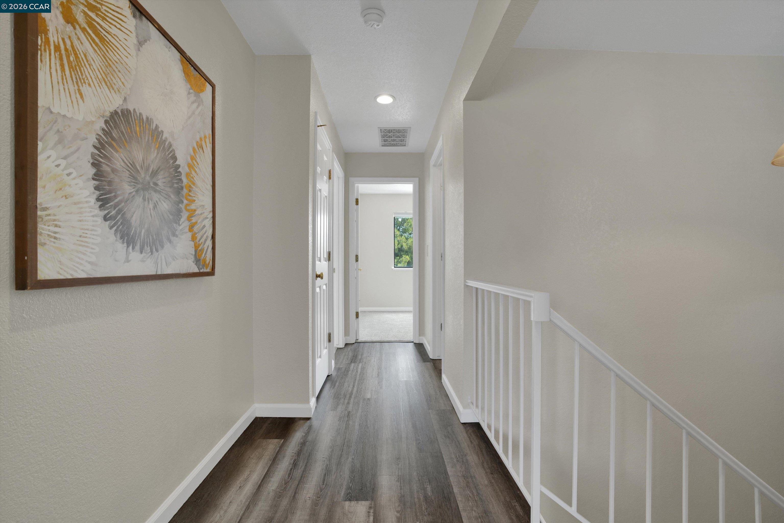 1605 Riverlake Road Discovery Bay, CA 94505 - Photo 22 of 39 a view of a hallway with wooden floor