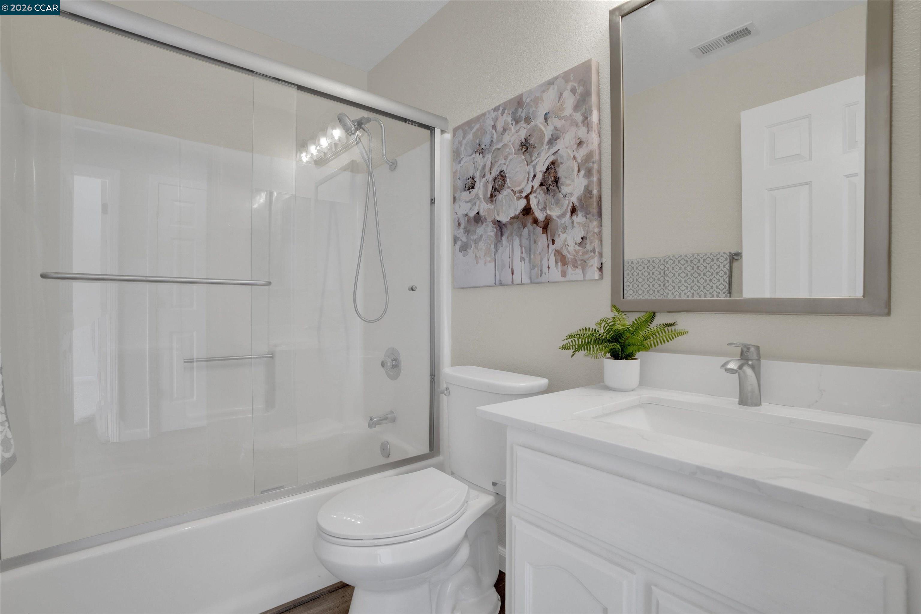 1605 Riverlake Road Discovery Bay, CA 94505 - Photo 32 of 39 a bathroom with a sink a toilet and shower