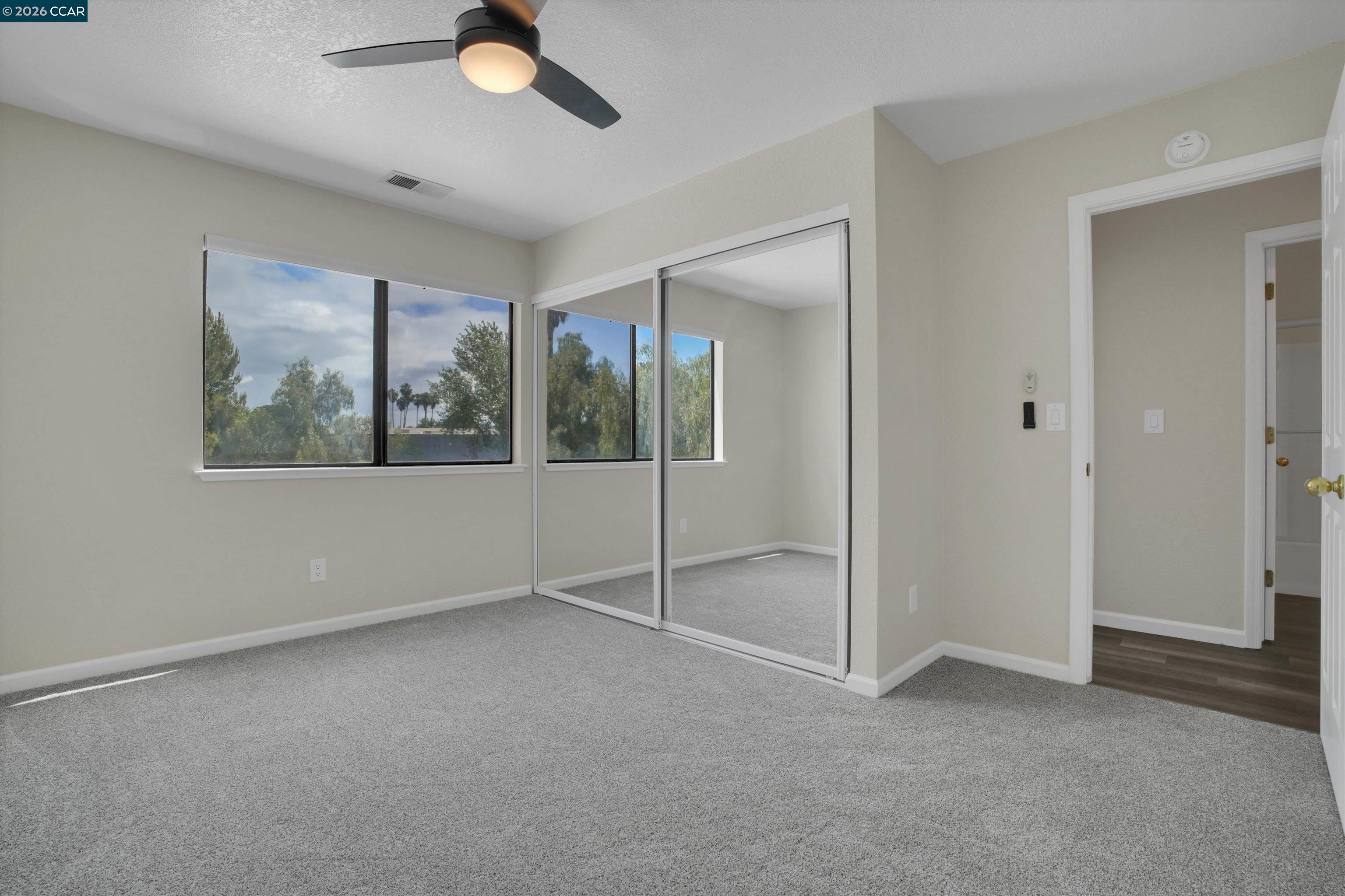 1605 Riverlake Road Discovery Bay, CA 94505 - Photo 34 of 39 an empty room with closet and windows