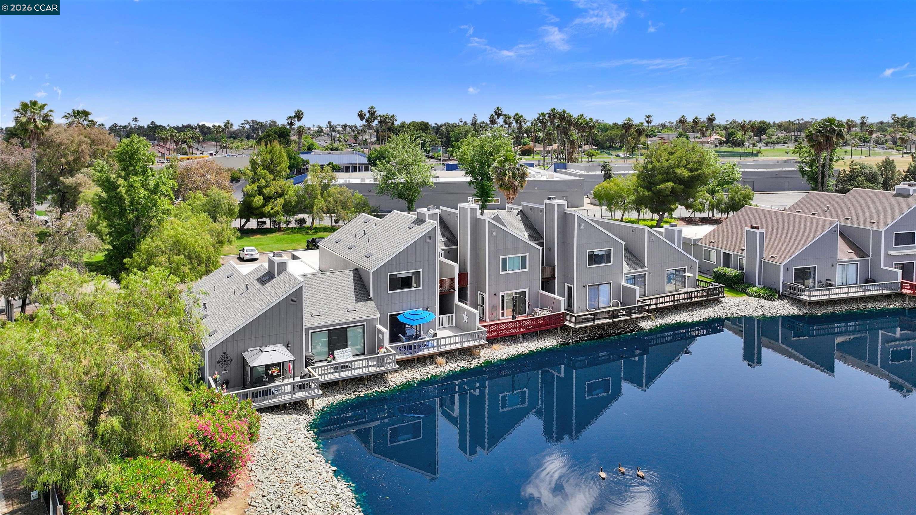 1605 Riverlake Road Discovery Bay, CA 94505 - Photo 36 of 39 a aerial view of a house with a swimming pool and outdoor seating