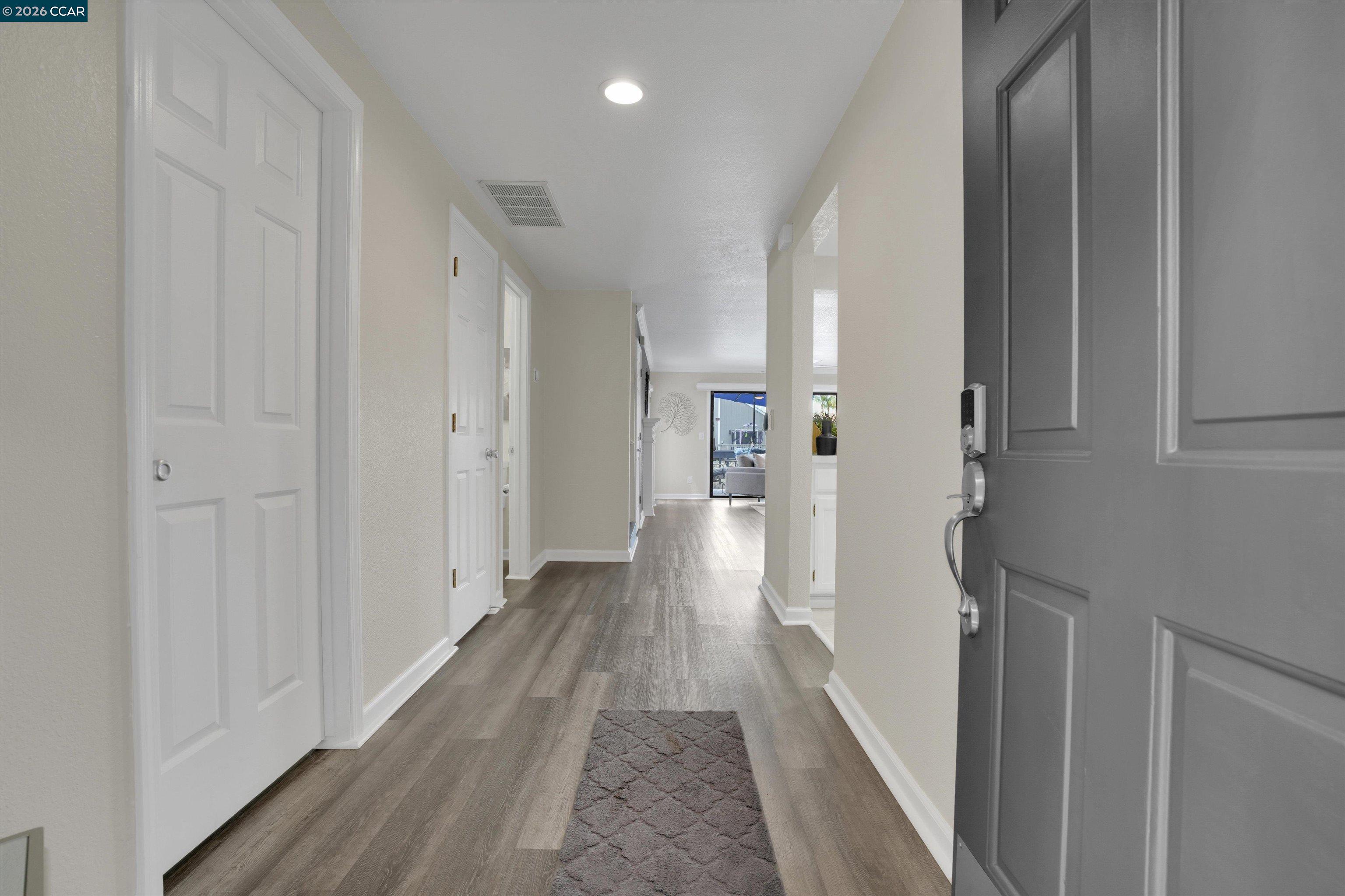 1605 Riverlake Road Discovery Bay, CA 94505 - Photo 6 of 39 a view of a hallway with wooden floor
