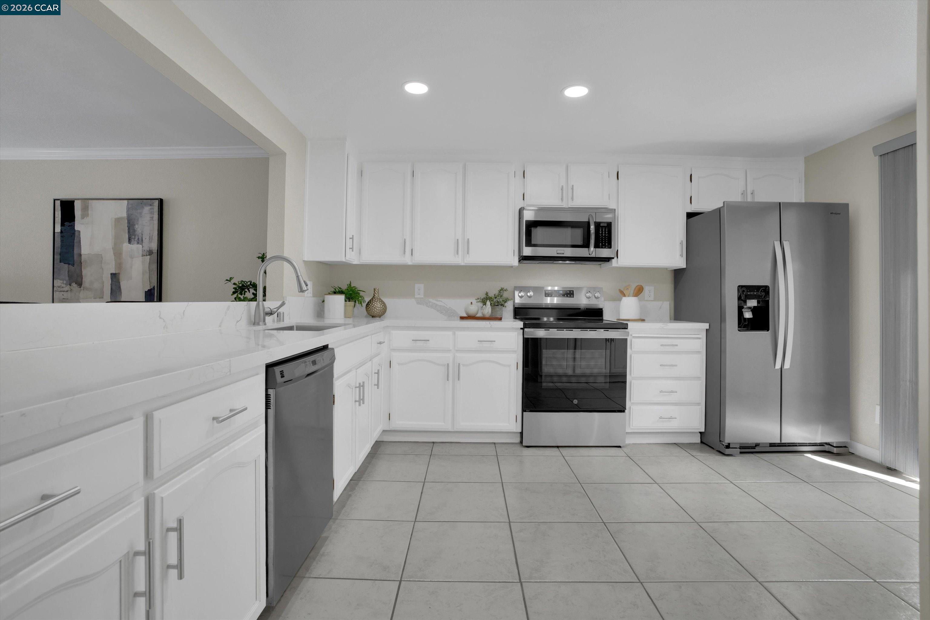 1605 Riverlake Road Discovery Bay, CA 94505 - Photo 7 of 39 a kitchen with a sink a stove and refrigerator