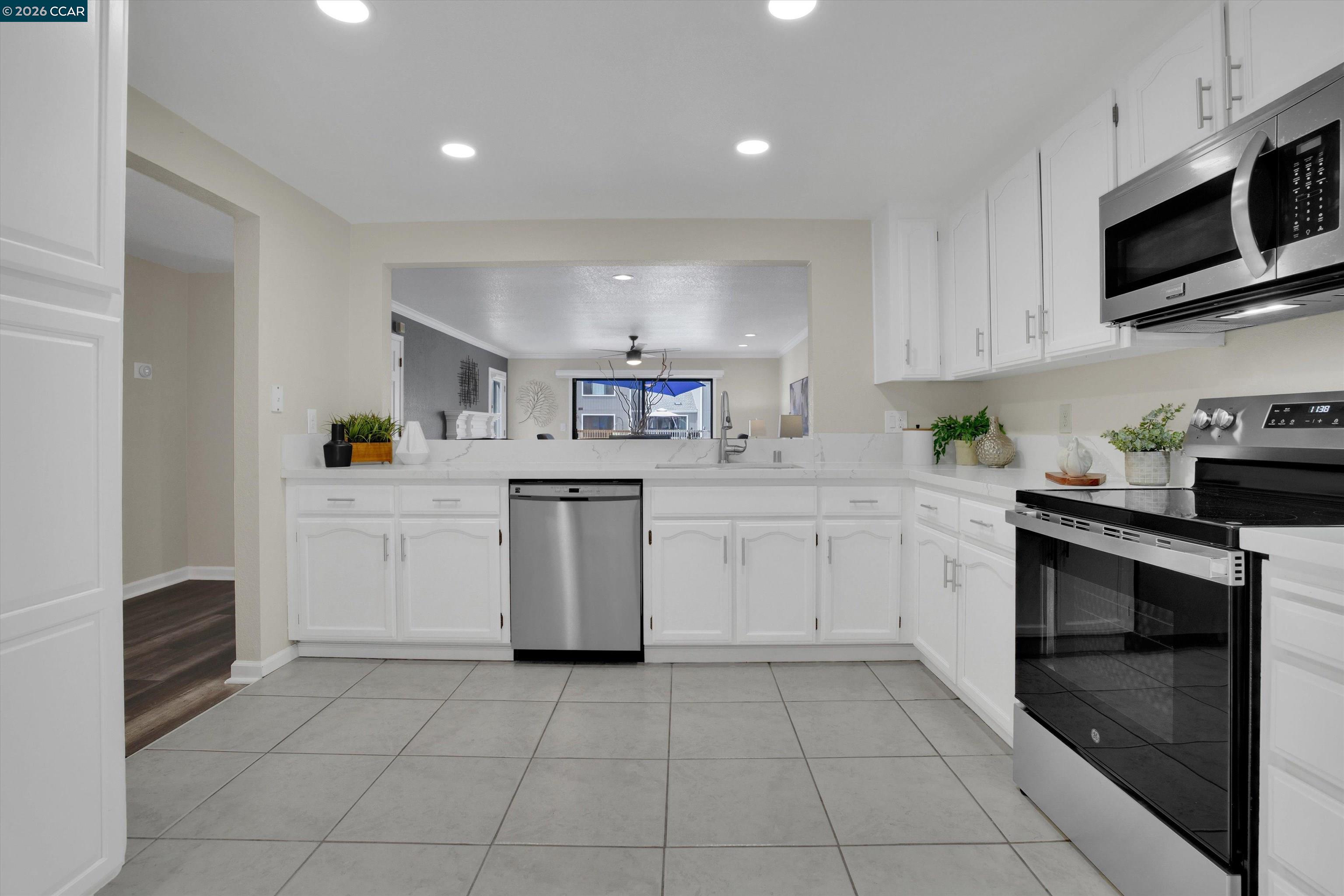 1605 Riverlake Road Discovery Bay, CA 94505 - Photo 8 of 39 a kitchen with a sink a stove and cabinets