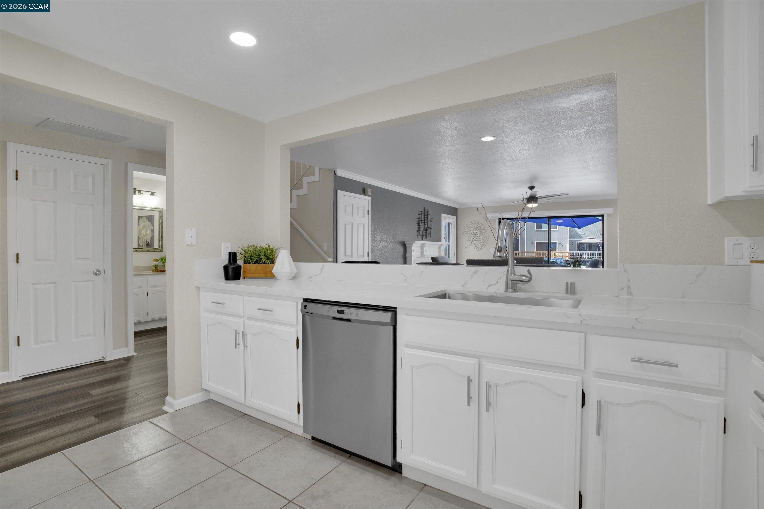 1605 Riverlake Road Discovery Bay, CA 94505 - Photo 10 of 39 a kitchen with white cabinets and sink