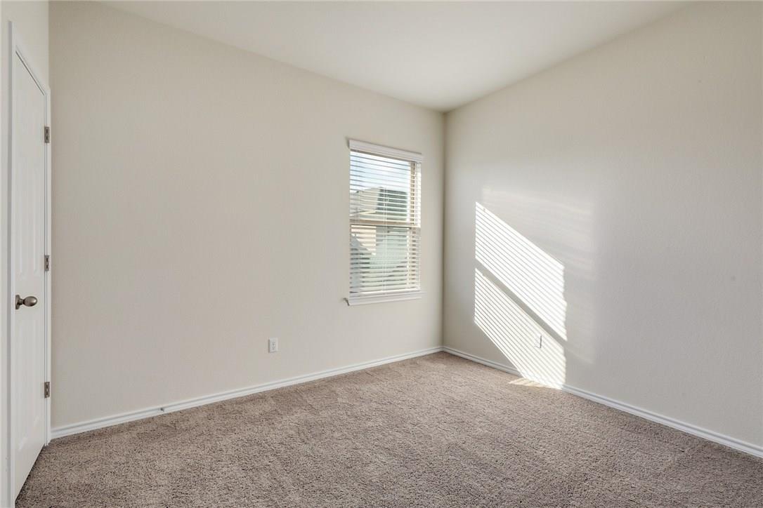2105 Town Centre Drive, Unit 49 Round Rock, TX 78664 - Photo 13 of 22 a view of an empty room with a window