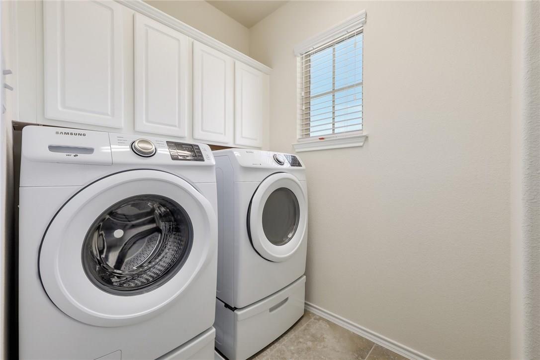 2105 Town Centre Drive, Unit 49 Round Rock, TX 78664 - Photo 16 of 22 a utility room with dryer and washer