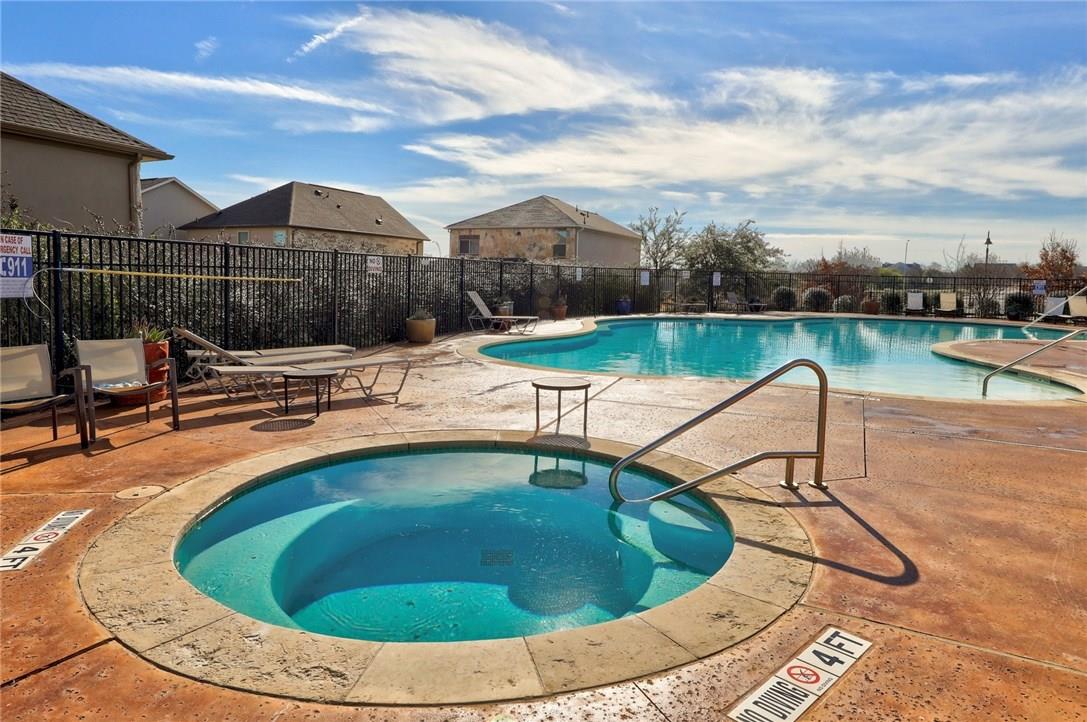 2105 Town Centre Drive, Unit 49 Round Rock, TX 78664 - Photo 20 of 22 a view of a swimming pool with a lounge chair