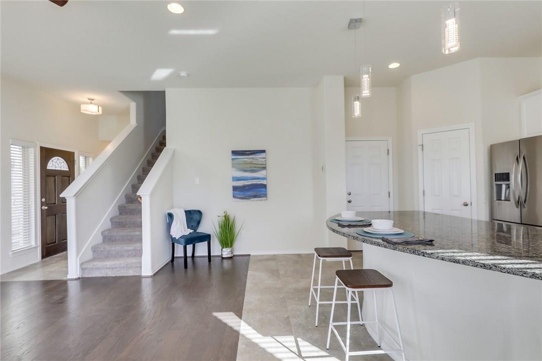 2105 Town Centre Drive, Unit 49 Round Rock, TX 78664 - Photo 7 of 22 a dining room with furniture and wooden floor