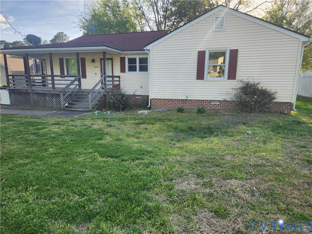 6833 Hearthside Drive Prince George, VA 23875 - Photo 1 of 6 a front view of a house with a yard