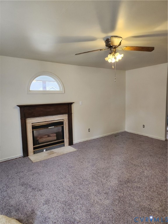 6833 Hearthside Drive Prince George, VA 23875 - Photo 6 of 6 a view of an empty room with a fireplace and a ceiling fan