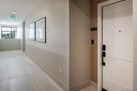 a view of an entryway with wooden floor