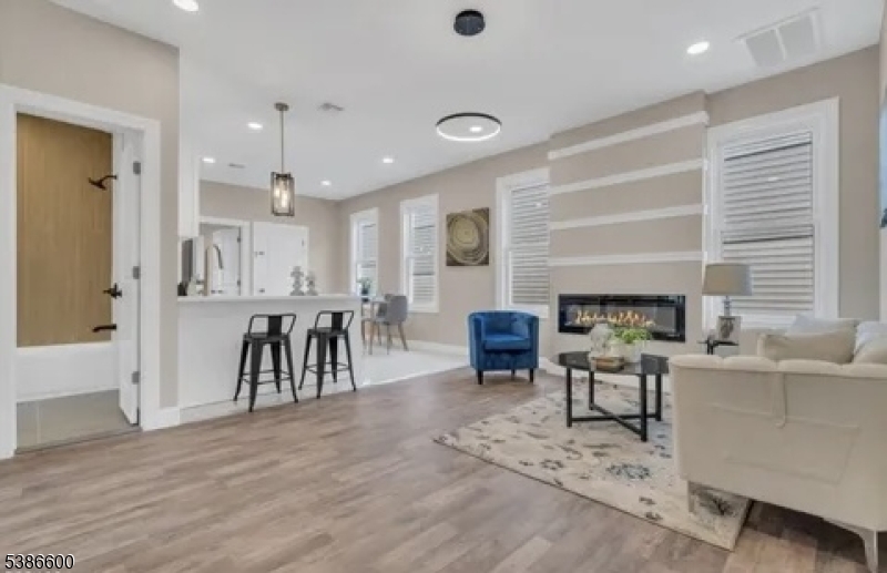 89 Schley Street, Unit 2 Newark, NJ 07112 - Photo 3 of 18 a living room with furniture and a table