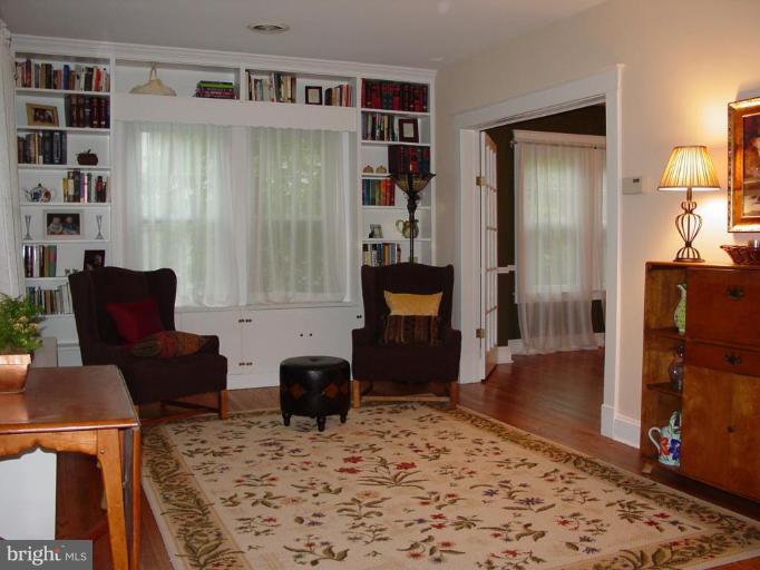 520 Anneslie Road Baltimore, MD 21212 - Photo 3 of 29 Built-in bookcases flank double windows.