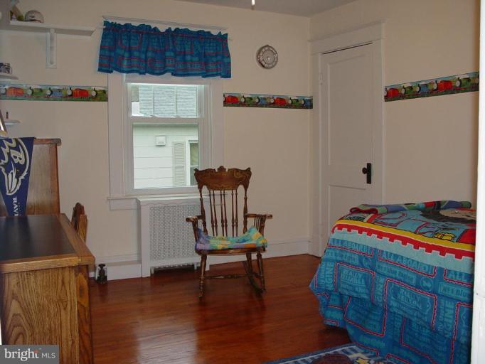 520 Anneslie Road Baltimore, MD 21212 - Photo 22 of 29 Second bedroom, with pine flooring and huge closet