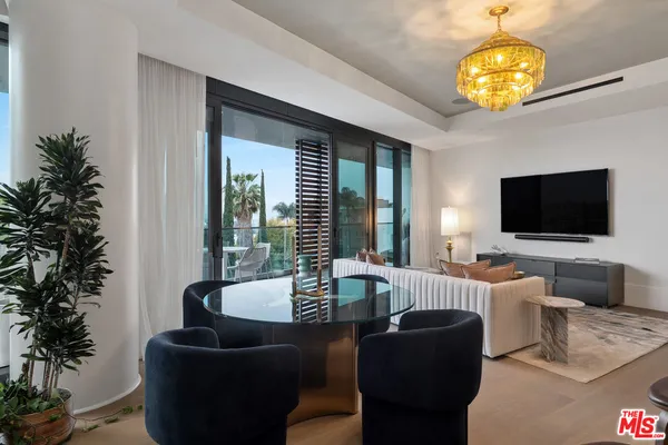 a living room with fireplace furniture and a flat screen tv