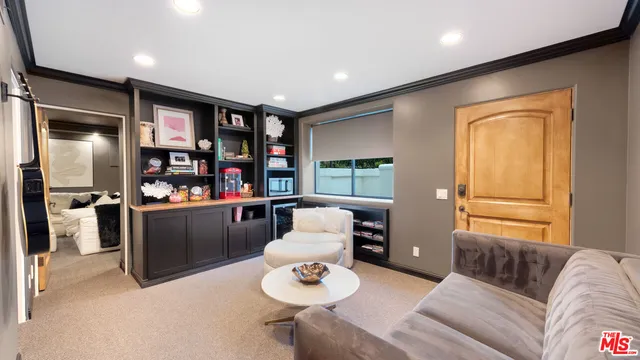 an aerial view of a house with a yard basket ball court and outdoor seating