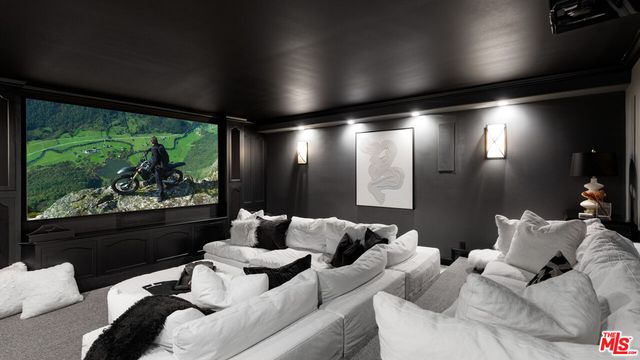 a view of a patio with table and chairs potted plants with wooden floor
