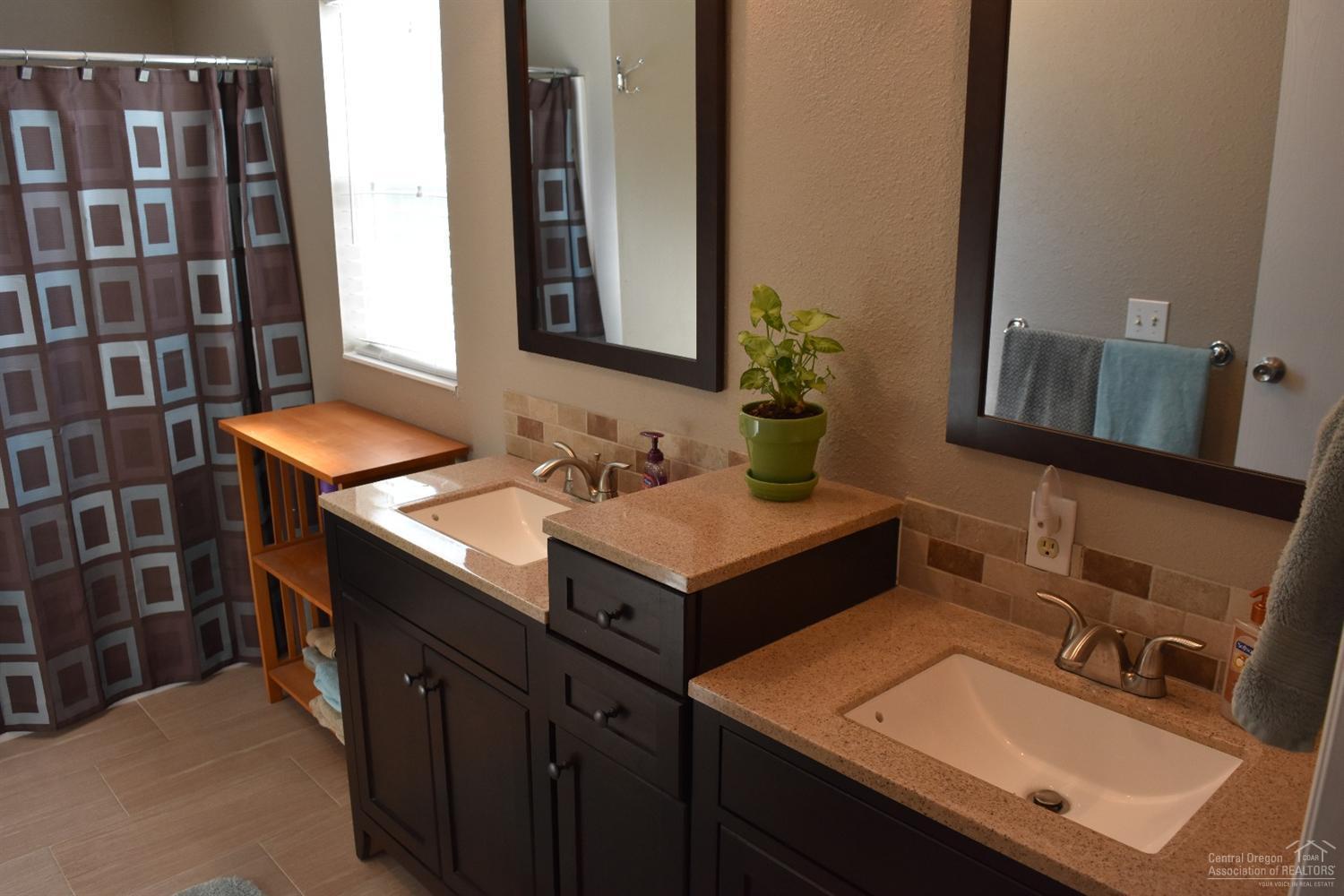 56045 Black Duck Road Bend, OR 97707 - Photo 17 of 22 a bathroom with a sink and a mirror