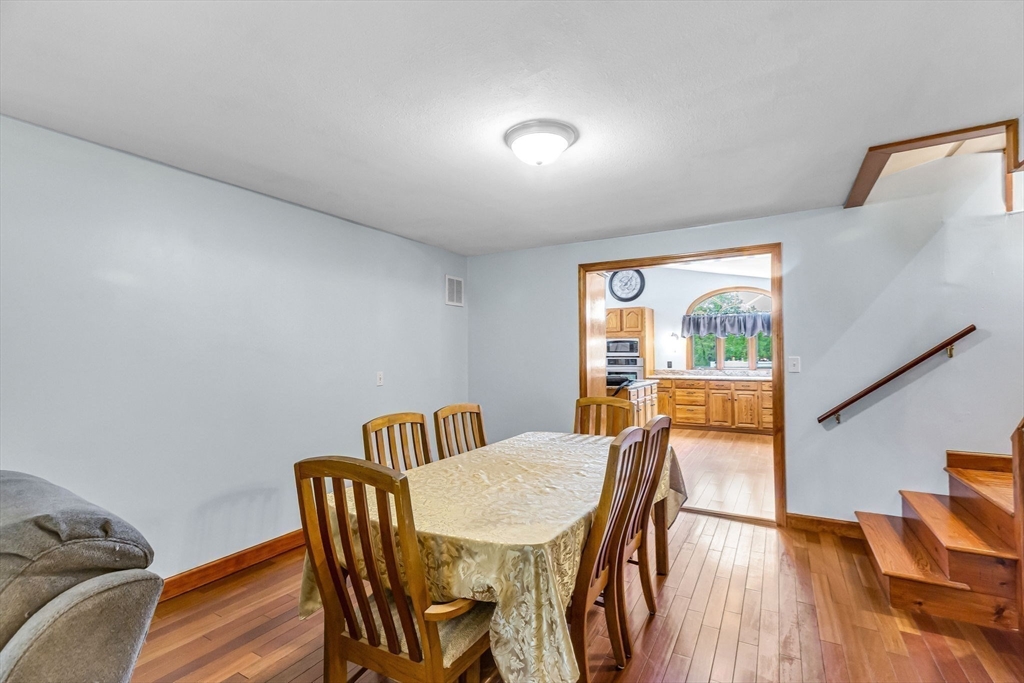 98 Town Farm Road Monson, MA 01057 - Photo 18 of 41 a view of a dining room with furniture and wooden floor